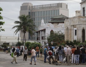 People wait to apply for visas in the U.S. Interests Section,  in Havana