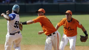 Villa Clara's short stop Diaz tries to put out Industriales' Mayeta during their final playoff baseball game in the Cuban National Series in Havana