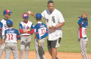 White Sox first baseman Jose Abreu, from Cuba, gives a baseball clinic to children in Havana, Cuba,  (AP/Espinosa).