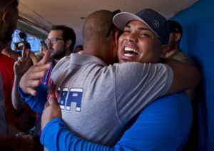 Cuban Ballplayers embrace.