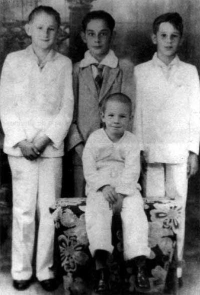 "The brothers Ramón, Fidel (in white) and Raúl (seated), with a friend in The brothers Ramón, Fidel (in white) and Raúl (seated), the two brothers, , With a friend in La Salle of Santiago de Cuba. 