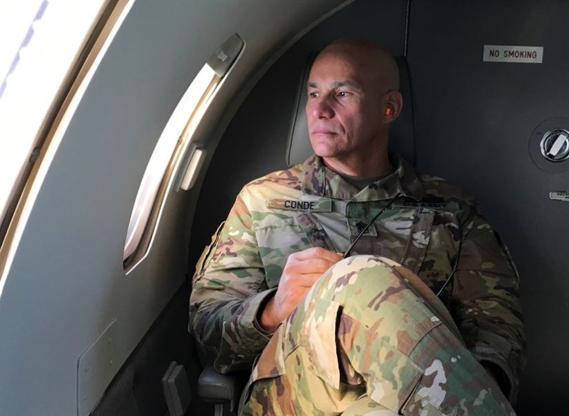 Sergeant Major Rafael Conde glances from the plane to the Naval Station of Guantánamo, Cuba (Photo: Wisconsin National Guard)