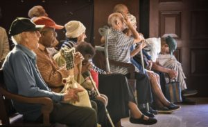 Several elderly people are waiting to receive medical assistance at La Milagrosa's House of La Habana.