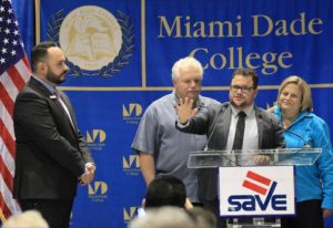 SAVE Executive Director Tony Lima, left, former U.S. Attorney Dexter Lehtinen, and Congresswomen, Ileana Ros-Lehtinen, right, join Rodrigo Heng-Lehtinen, who is transgender, center, on stage as he gives remarks regarding his family's support during the launching of the PSA on LGBT nondiscrimination featuring his parents called " Family is Everything" on Monday, May 16, 2016. (CARL JUSTE Miami Herald File)