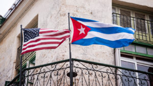 US and Cuban flags side by side in Havana, Cuba