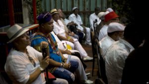 Santeria priest attend the annual "Letter of the Year" from Afro-Cuban Santeria priests, which gives predictions for the new year in Havana, Cuba, Sunday, Jan. 3, 2017. (AP Photo/Ramon Espinosa)