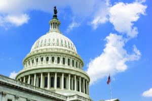 US Capitol dome with US flag